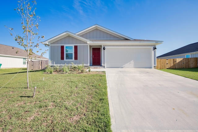 ranch-style home featuring an attached garage, fence, concrete driveway, and a front yard
