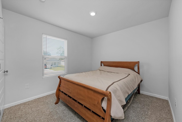 bedroom with baseboards and carpet flooring