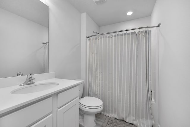 full bath featuring toilet and vanity