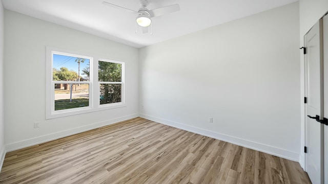 unfurnished room with light wood-type flooring and ceiling fan