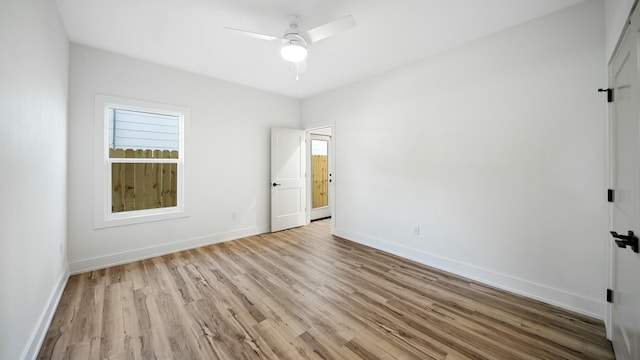 spare room featuring ceiling fan and light hardwood / wood-style floors