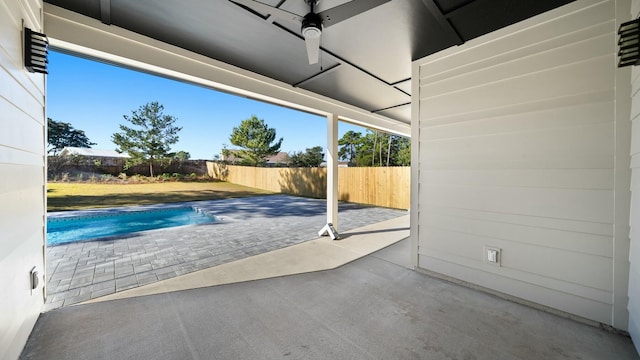 view of swimming pool with a patio