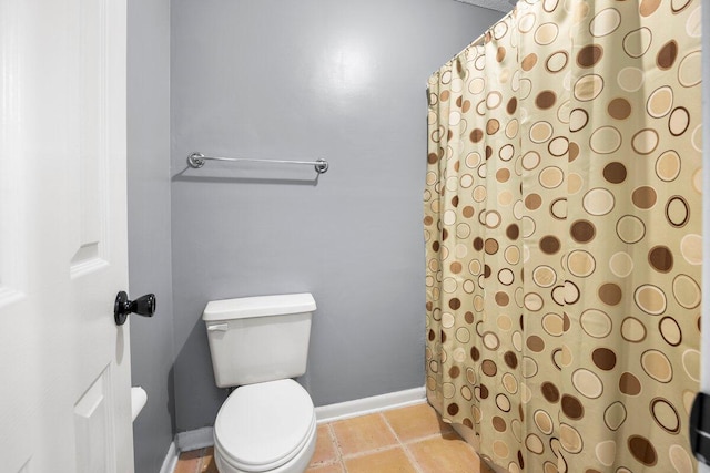 2205 Calle De Marbella, Navarre, FL 32566 - bathroom featuring a shower with shower curtain, baseboards, toilet, and tile patterned flooring
