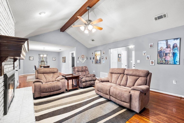 2205 Calle De Marbella, Navarre, FL 32566 - living area featuring visible vents, ceiling fan with notable chandelier, lofted ceiling with beams, and wood finished floors