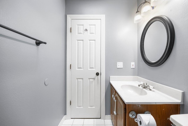 2205 Calle De Marbella, Navarre, FL 32566 - bathroom featuring tile patterned floors, baseboards, and vanity