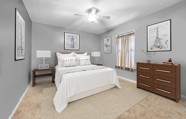 2205 Calle De Marbella, Navarre, FL 32566 - bedroom with ceiling fan, light colored carpet, baseboards, and a textured ceiling