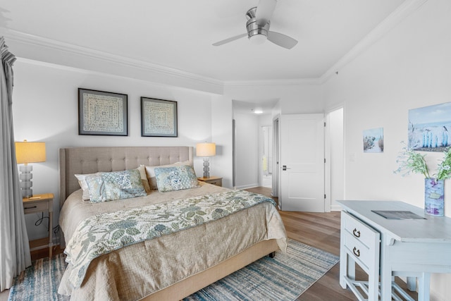 bedroom featuring crown molding, ceiling fan, and hardwood / wood-style flooring