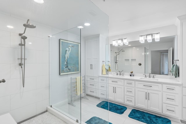 bathroom featuring tile patterned flooring, vanity, and an enclosed shower