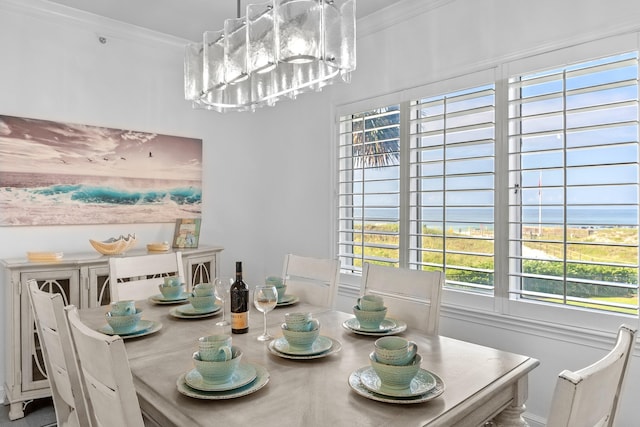 dining area featuring crown molding