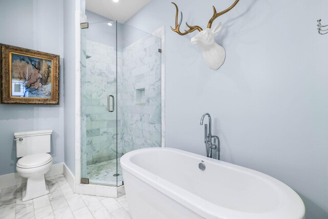 bathroom featuring toilet and separate shower and tub