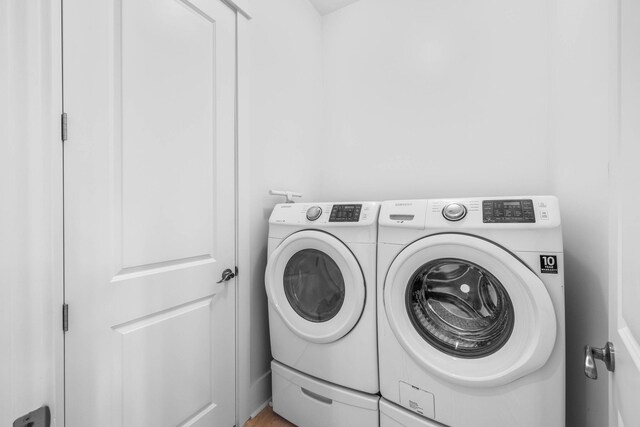 laundry room featuring separate washer and dryer