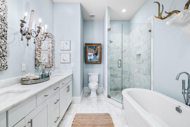 full bathroom featuring toilet, vanity, and separate shower and tub