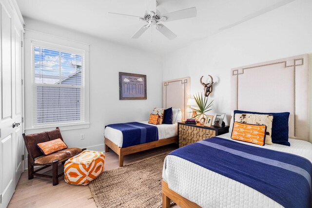 bedroom featuring ceiling fan and hardwood / wood-style flooring