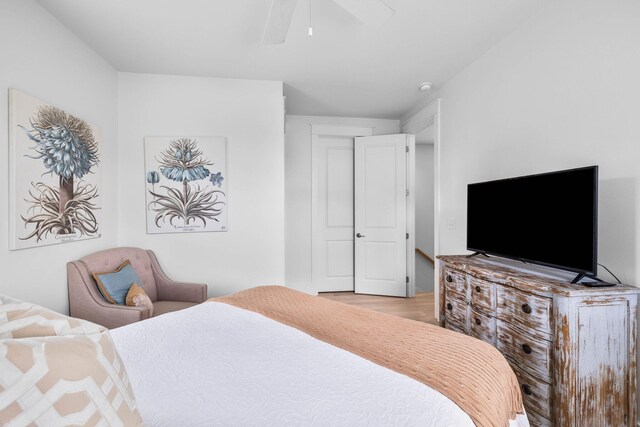 bedroom featuring ceiling fan and light hardwood / wood-style flooring