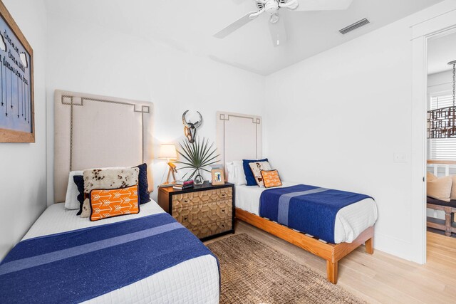 bedroom featuring hardwood / wood-style floors and ceiling fan