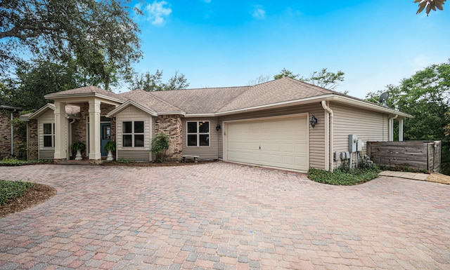 single story home featuring a garage