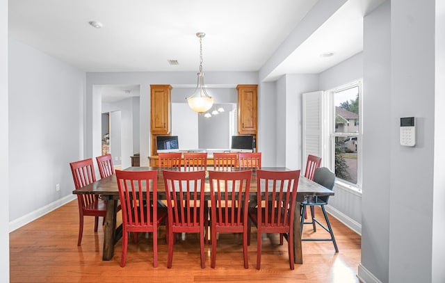 dining space with light wood-type flooring