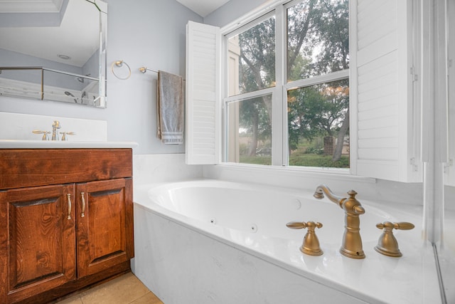 bathroom featuring vanity, a healthy amount of sunlight, independent shower and bath, and tile patterned floors