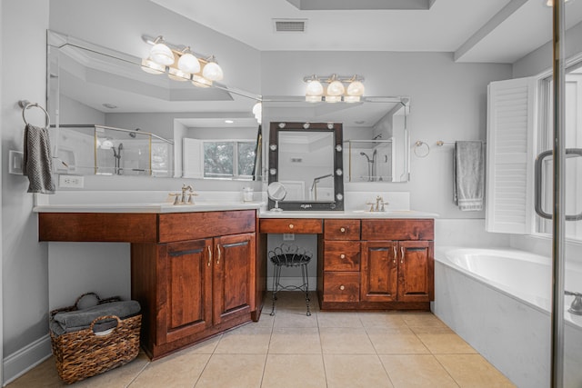 bathroom featuring tile patterned flooring, independent shower and bath, and vanity