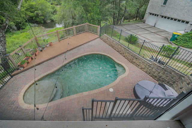 view of swimming pool featuring a patio area