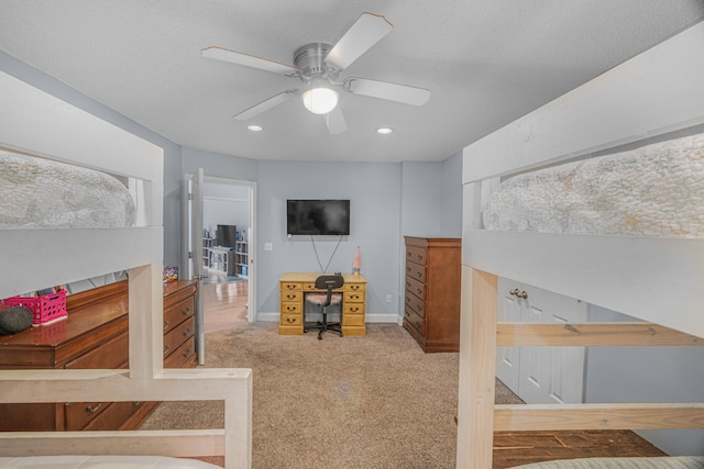 bedroom with ceiling fan and carpet floors