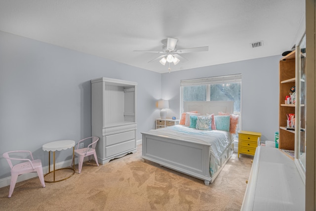 bedroom featuring ceiling fan and light colored carpet