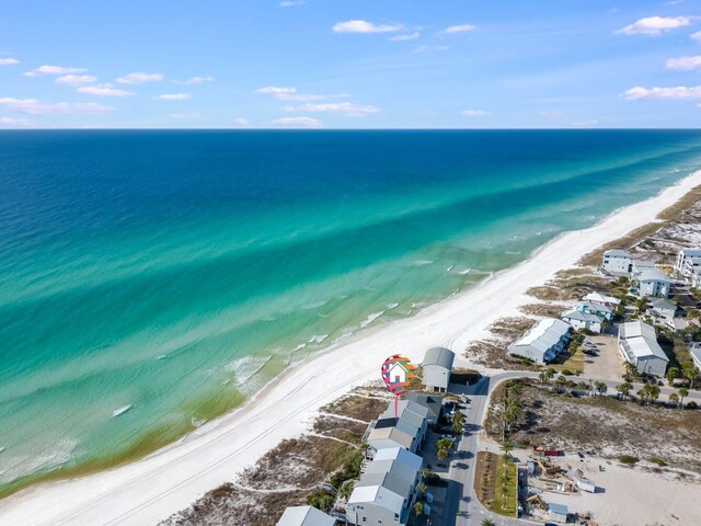 drone / aerial view featuring a view of the beach and a water view