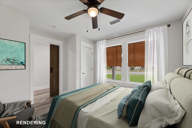 bedroom featuring ceiling fan and hardwood / wood-style floors