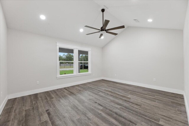 empty room featuring dark hardwood / wood-style floors, ceiling fan, and high vaulted ceiling