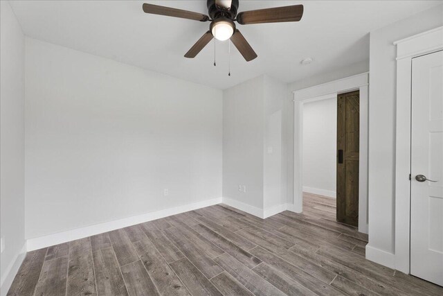 unfurnished room featuring hardwood / wood-style flooring and ceiling fan