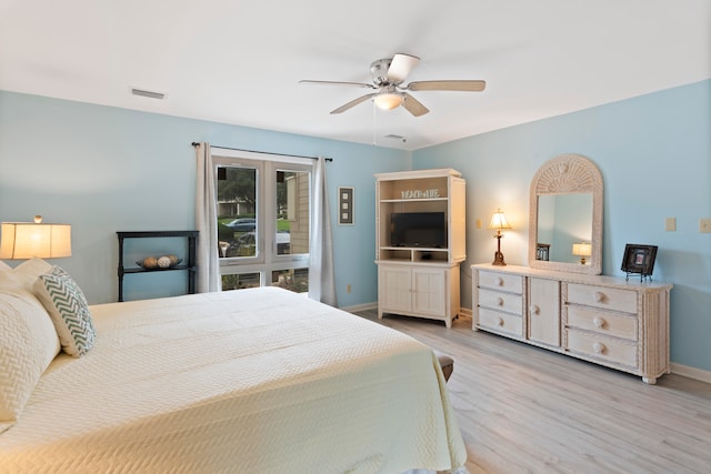 bedroom featuring light wood-type flooring and ceiling fan