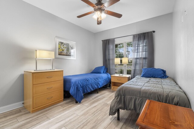 bedroom featuring light hardwood / wood-style flooring and ceiling fan