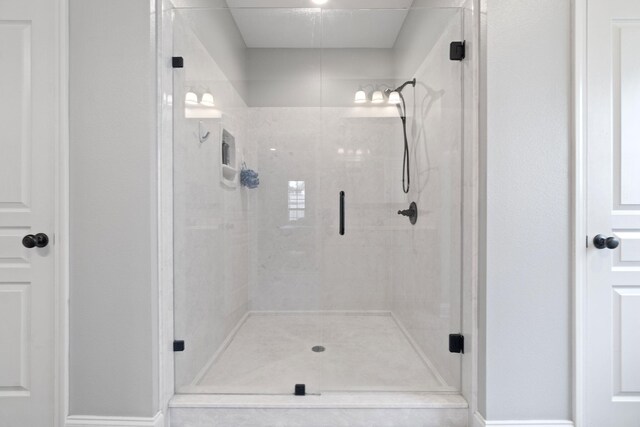 bathroom featuring an enclosed shower