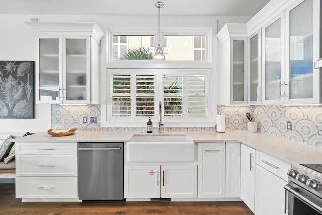 kitchen featuring dark wood-type flooring, sink, white cabinets, and hanging light fixtures