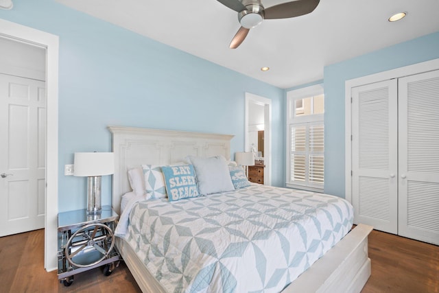 bedroom featuring dark wood-type flooring, ceiling fan, and a closet