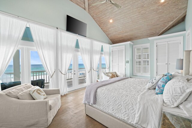 bedroom with a closet, french doors, light hardwood / wood-style floors, wood ceiling, and access to outside