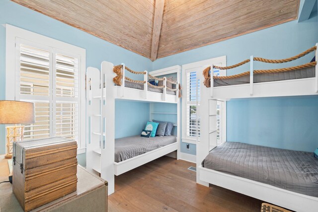 bedroom featuring wood ceiling and dark hardwood / wood-style floors