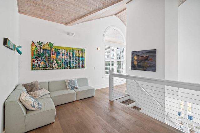 living room with wood ceiling, vaulted ceiling, and hardwood / wood-style flooring