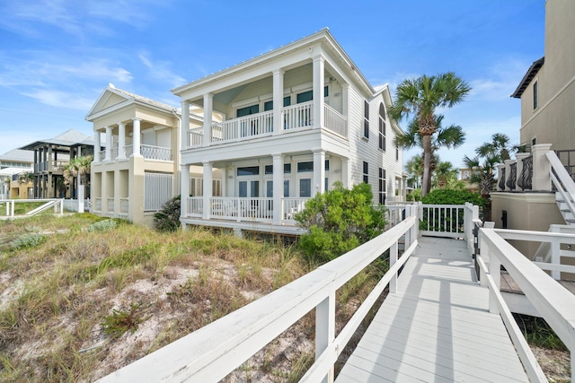 rear view of property featuring a balcony