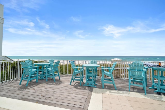 view of patio with a deck with water view