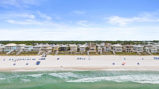 drone / aerial view with a view of the beach and a water view