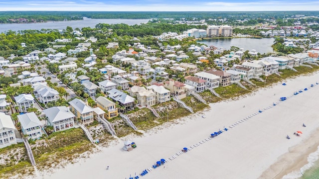 bird's eye view featuring a beach view and a water view