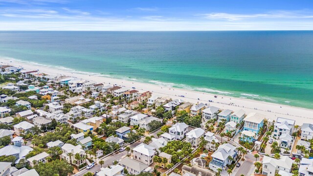 drone / aerial view with a view of the beach and a water view