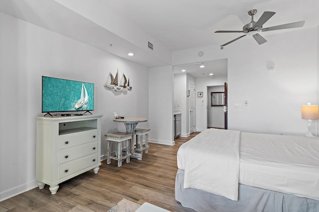 bedroom with wood-type flooring and ceiling fan