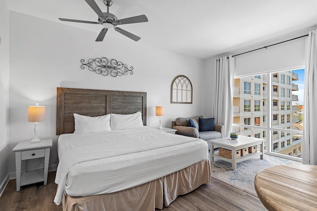 bedroom with dark hardwood / wood-style flooring and ceiling fan