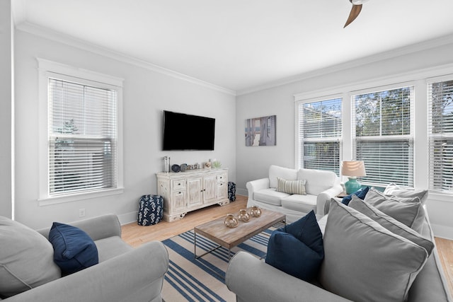 living room with ornamental molding, hardwood / wood-style floors, and ceiling fan