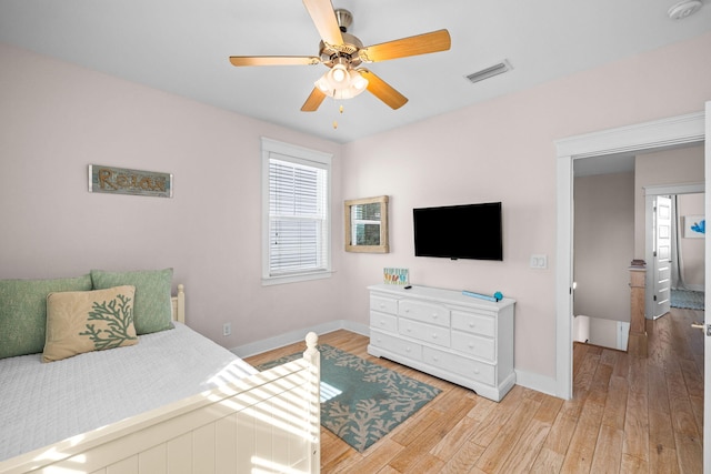 bedroom with ceiling fan and hardwood / wood-style flooring