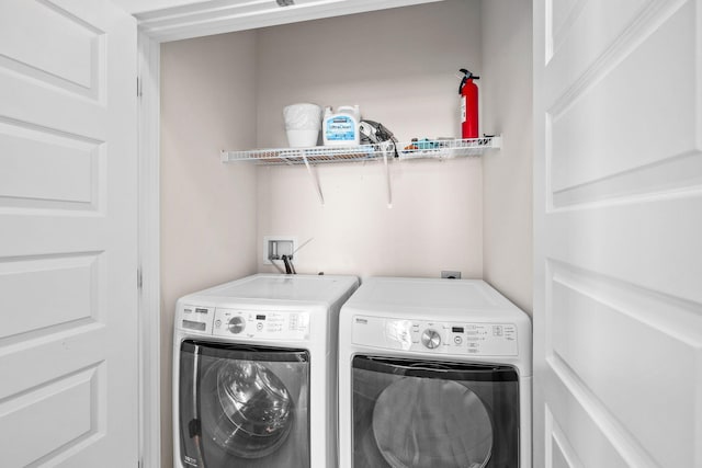 laundry room featuring separate washer and dryer