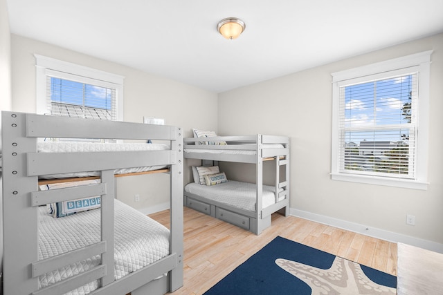 bedroom with wood-type flooring