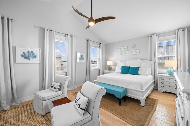 bedroom with light hardwood / wood-style flooring, lofted ceiling, and ceiling fan